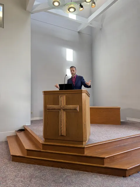 A speaker delivering a message from the pulpit