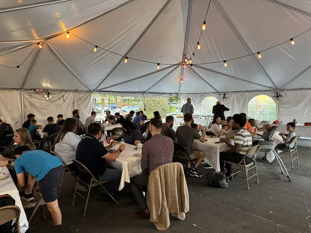 Attendees gathered for fellowship under the tent
