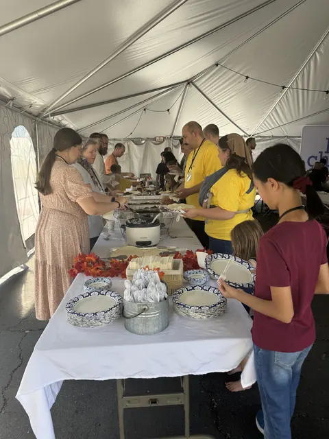 Serving the meal under the tent