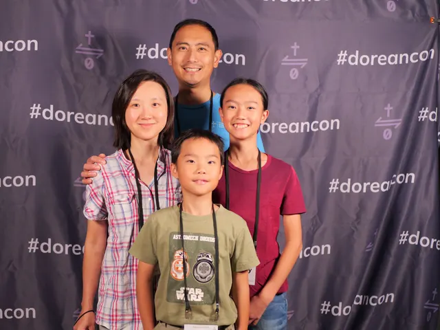 A family at the #doreancon photo backdrop