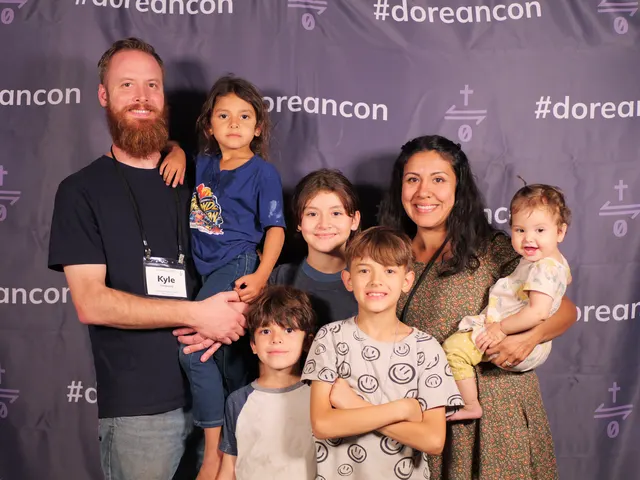 A family at the #doreancon photo backdrop